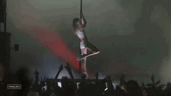 Pole Dancing In Stage In Crowded Event GIF