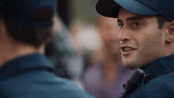 Police Cop Smiling Head Shake GIF