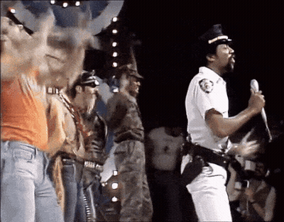Police Man Singing Into Microphone On Stage GIF