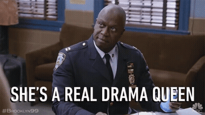 Police Man Sitting At Desk She's A Real Drama Queen GIF