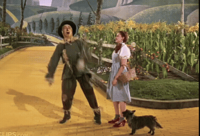 Police Man Talking To Puppet On Red Couch GIF