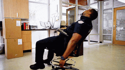 Police Officer Head Down In Office Chair GIF