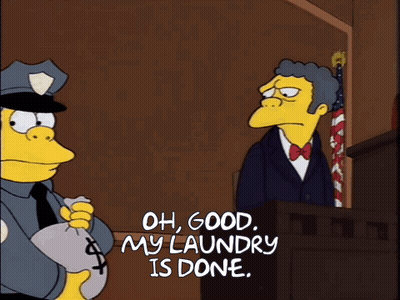 Police Officer Holding Money Bag Saying Oh Good My Laundry Is Done GIF
