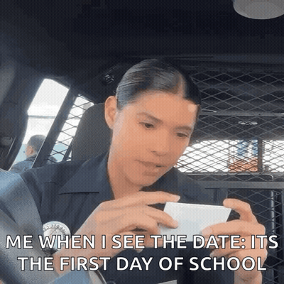 Police Officer In Back Of Car On Phone GIF