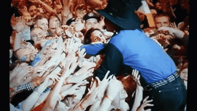 Police Officer In Front Of Crowd GIF