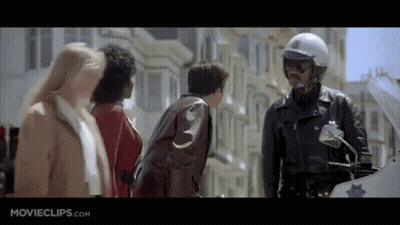 Police Officer On Motorcycle Talking To Group GIF