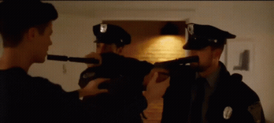 Police Officer Pointing Gun At Officer With Flashlight GIF