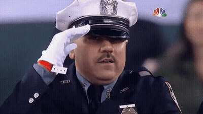 Police Officer Saluting With NBC Logo GIF