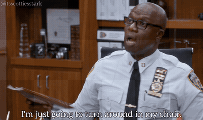 Police Officer Sitting At Desk Says I'm Just Going To Turn Around In My Chair GIF