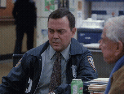 Police Officer Sitting At Table With Gatorade GIF