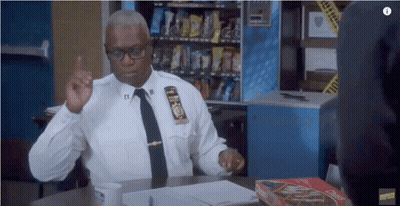 Police Officer Sitting With Box Of Chex Mix GIF