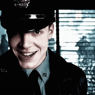 Police Officer Smiling With PD Badge GIF