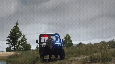 Police Officer Standing In Front Of Blue Utility Vehicle GIF