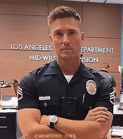 Police Officer Standing With Arms Crossed GIF