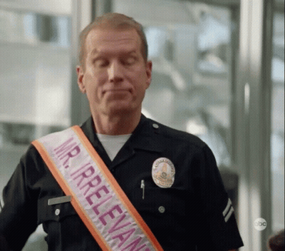 Police Officer Wearing Mr Irrelevant Sash GIF
