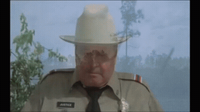 Police Officer With Justice On Uniform GIF