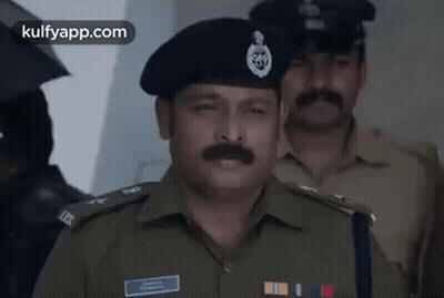 Police Officer With Mustache and Beret in Line