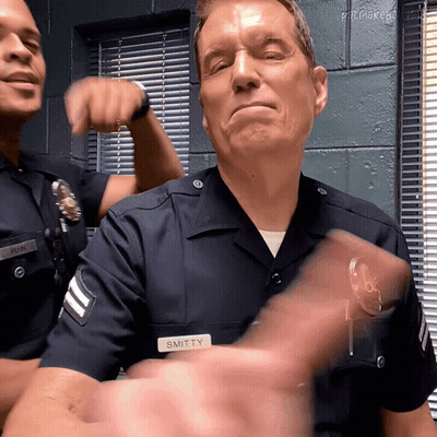 Police Officer With Smitten Name Tag GIF
