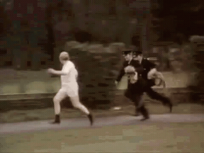 Police Officers Chasing Man In White Shirt GIF