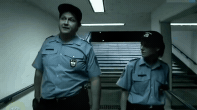 Police Officers In Front Of Champions League Building GIF