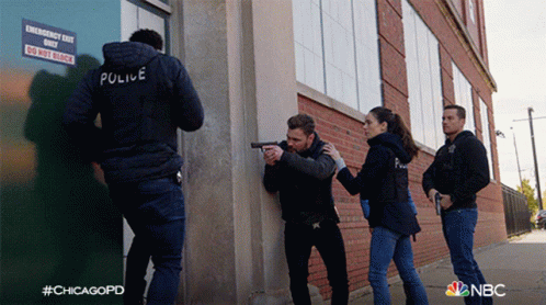 Police Officers In Front Of Emergency Do Not Block Sign GIF