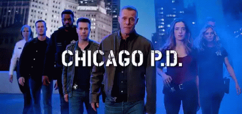 Police Officers Standing Next To Each Other City Skyline GIF