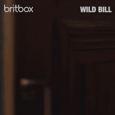 Police Uniform Man Peeking From Behind Door Britbox Wild Bill GIF