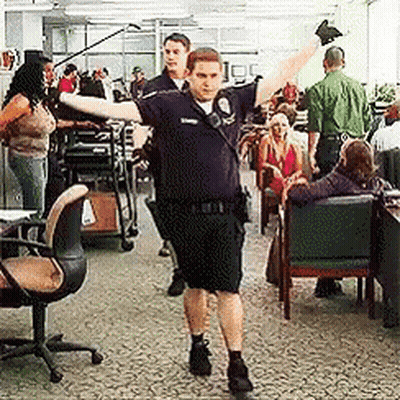Policeman Dancing Arms Outstretched GIF