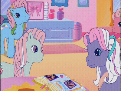 Ponies Looking at Book Saying Friendship Is Magic