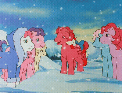 Ponies Standing In Snow With Bow On Tail GIF