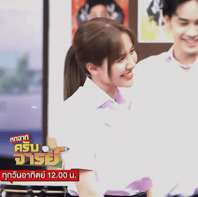 Ponytail Girl Smiling By 12.00 Sign GIF