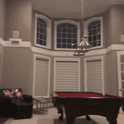 Pool Table In Living Room With Large Window GIF