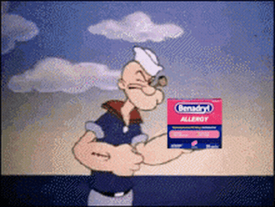 Popeye Is Holding A Box Of Benadryl Allergy Tablets GIF