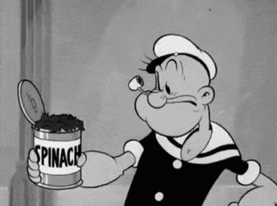 Popeye Is Holding A Can Of Spinach In His Hand . GIF
