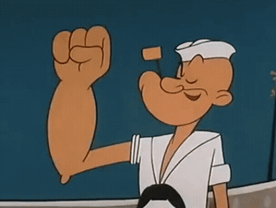 Popeye The Sailor Is Flexing His Muscles In A Cartoon While Standing On A Boat . GIF