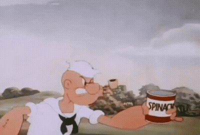 Popeye The Sailor Is Holding A Can Of Spinach And A Cup Of Coffee . GIF