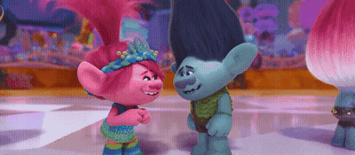 Poppy And Branch From Trolls Are Standing Next To Each Other On A Dance Floor . GIF