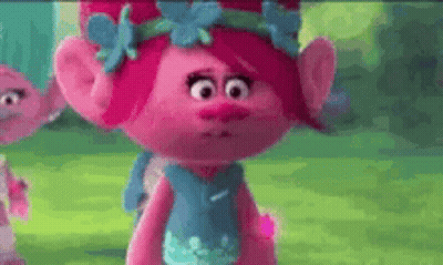 Poppy From Trolls Is Wearing A Blue Dress With Flowers On It . GIF