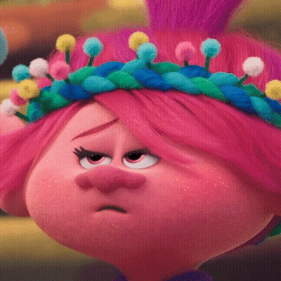 Poppy From Trolls Is Wearing A Crown Of Pom Poms On Her Head And Making A Sad Face . GIF