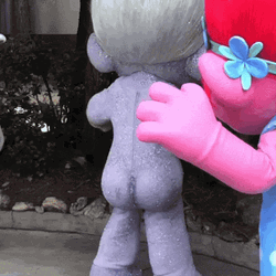 Poppy Mascot Glitter Bomb From Back GIF