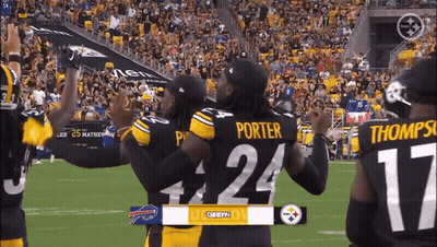 Porter #24 And Thompson #17 Hugging On Field GIF