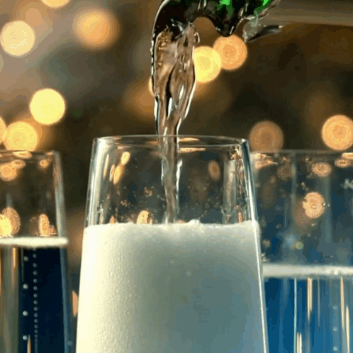Pouring Champagne Into Glass GIF