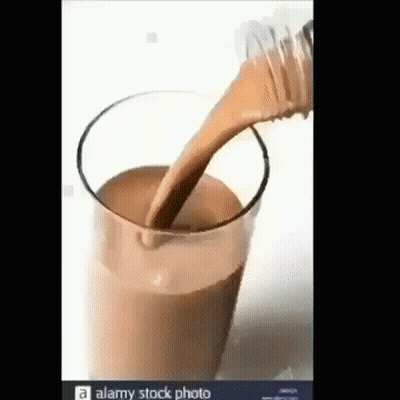 Pouring Chocolate Milk From Bottle Into Glass GIF