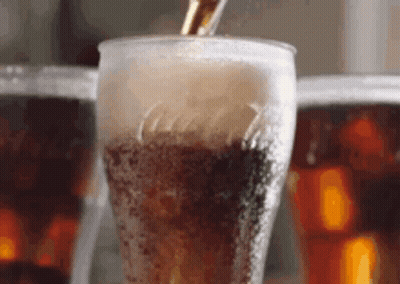 Pouring Cola Into Glass With Ice GIF