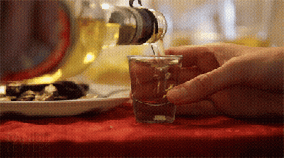Pouring Drink From Bottle With Danish Letters GIF