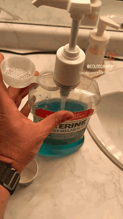 Pouring Glycerine Mouthwash Into Measuring Cup GIF