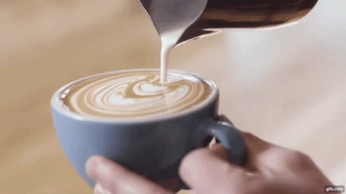 Pouring Milk Into Cup Of Coffee GIF