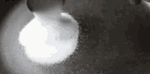 Pouring Salty Particles GIF