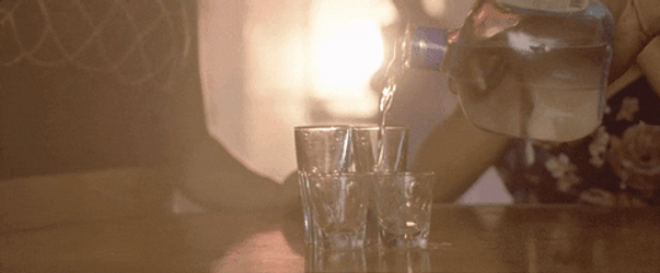 Pouring Two Shots Of Vodka On Glass GIF