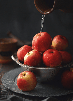 Pouring Water To Apple Fruit Bowl GIF
